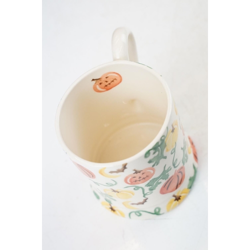 63 - A collection of three Emma Bridgewater Halloween pumpkin pattern items to include a 1/4 pint mug (Fi... 