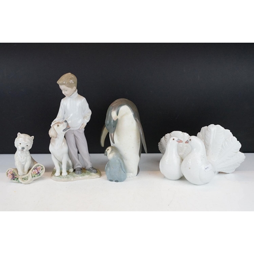 74 - Four Lladro porcelain figures / figure groups to include 6902 My Loyal Friend, 1169 Couple of Doves,... 