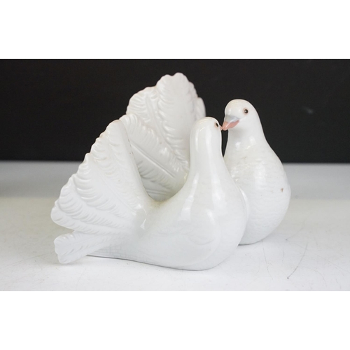 74 - Four Lladro porcelain figures / figure groups to include 6902 My Loyal Friend, 1169 Couple of Doves,... 