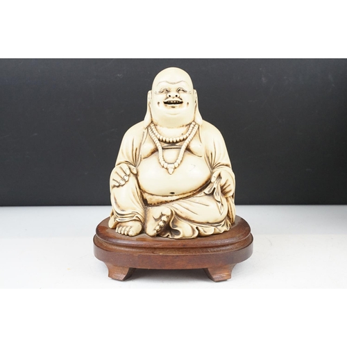 374 - A collection of oriental collectables to include a happy buddha ornament, Satsuma vase and figures.