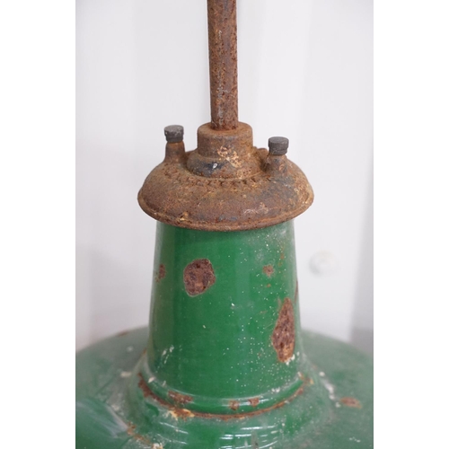 380 - A mid century industrial green enamel lamp by Revo.
