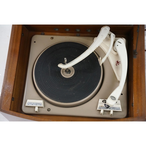 386 - A mid 20th century Dansette red table top record player together with a Pye black box wooden cased e... 