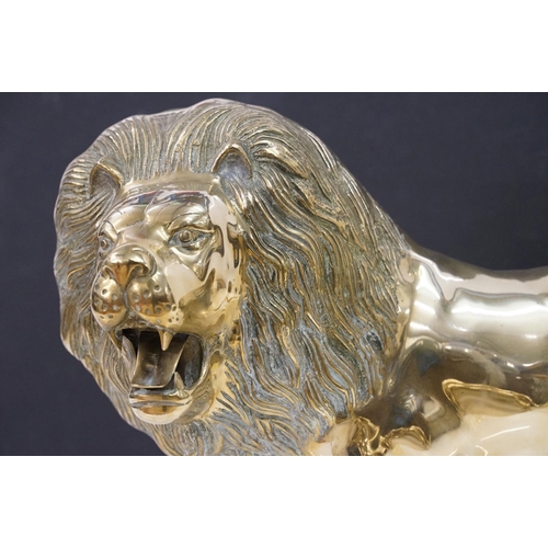 387 - A large Brass decorative ornamental lion together with a tiger.