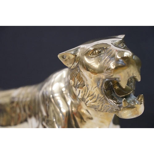 387 - A large Brass decorative ornamental lion together with a tiger.