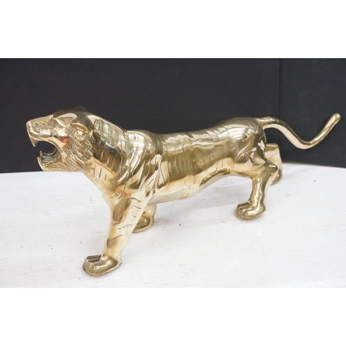 387 - A large Brass decorative ornamental lion together with a tiger.