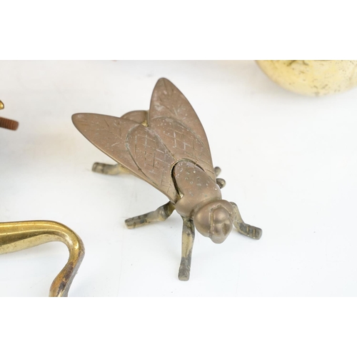 389 - A small collection of mixed brassware to include a fireside vesta in the form of a fly, fire dogs, d... 