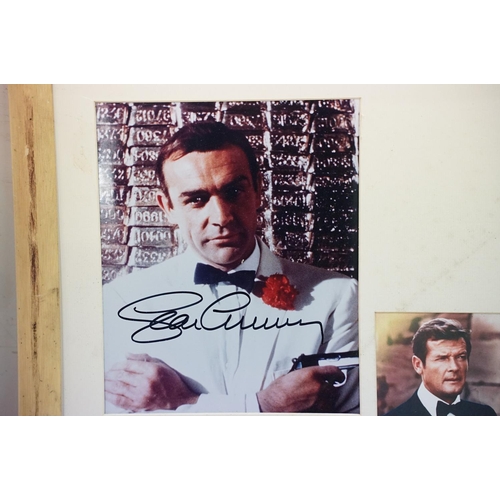 399 - Set of five James Bond photographs, signed, 56 x 60cm overall, James Bond 007 poster, gun symbol log... 