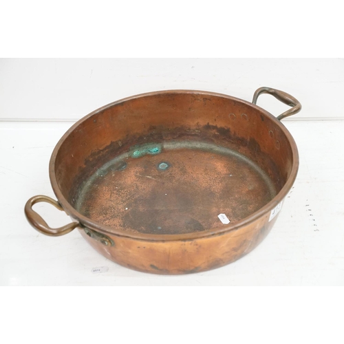 413 - Large copper shallow pan, with two brass handles, 12cm high (excluding handles), 41cm diameter (excl... 