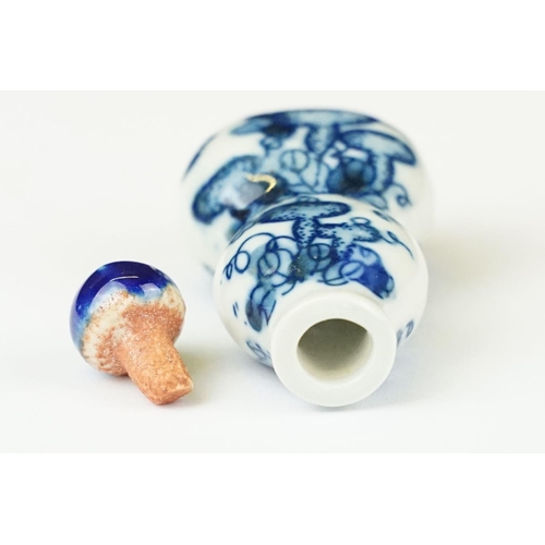 49 - Two Chinese blue and white ceramic snuff bottles with traditional Chinese decoration.