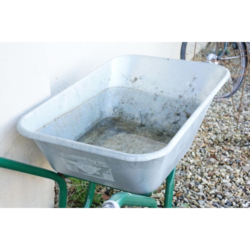 511 - Contemporary metal wheel barrow, measures approx 137cm long