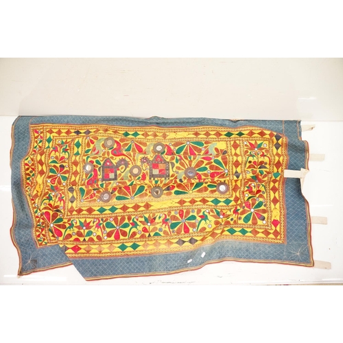 587 - Collection of Indian and middle eastern textiles to include a pair of Indian embroidered curtains fe... 