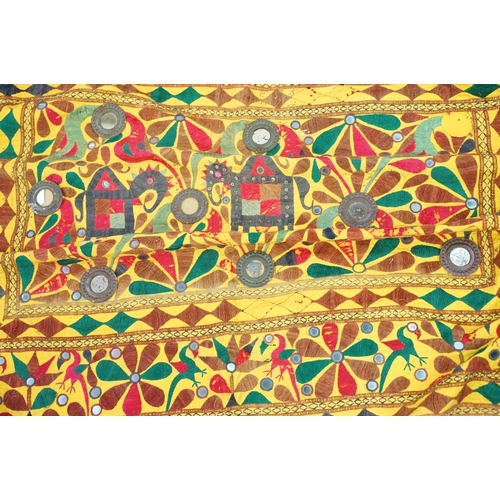 587 - Collection of Indian and middle eastern textiles to include a pair of Indian embroidered curtains fe... 