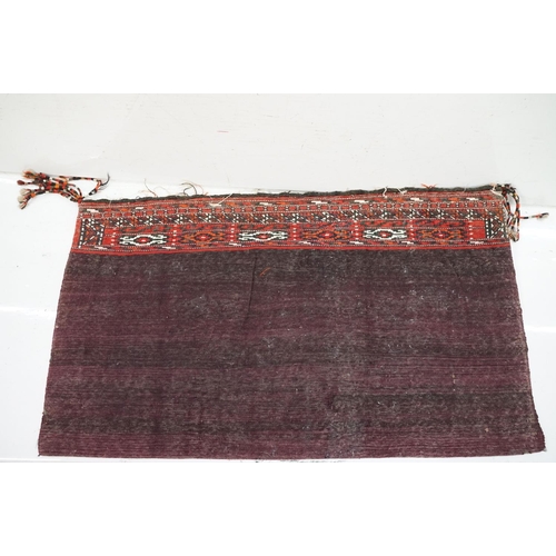 588 - Pair of large Afghan woven carpet saddle bags each with geometric detailing and woven tassels. Measu... 