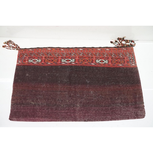 588 - Pair of large Afghan woven carpet saddle bags each with geometric detailing and woven tassels. Measu... 