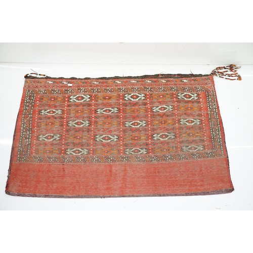 588 - Pair of large Afghan woven carpet saddle bags each with geometric detailing and woven tassels. Measu... 