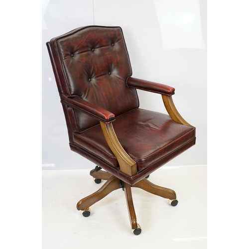 519 - Red leather adjustable height captain's chair, with button back, 107cm high x 60cm wide x 70cm deep ... 