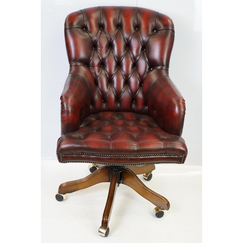 519 - Red leather adjustable height captain's chair, with button back, 107cm high x 60cm wide x 70cm deep ... 