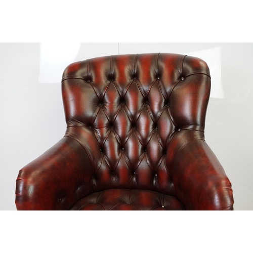 519 - Red leather adjustable height captain's chair, with button back, 107cm high x 60cm wide x 70cm deep ... 