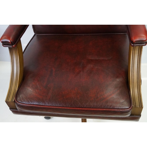 519 - Red leather adjustable height captain's chair, with button back, 107cm high x 60cm wide x 70cm deep ... 