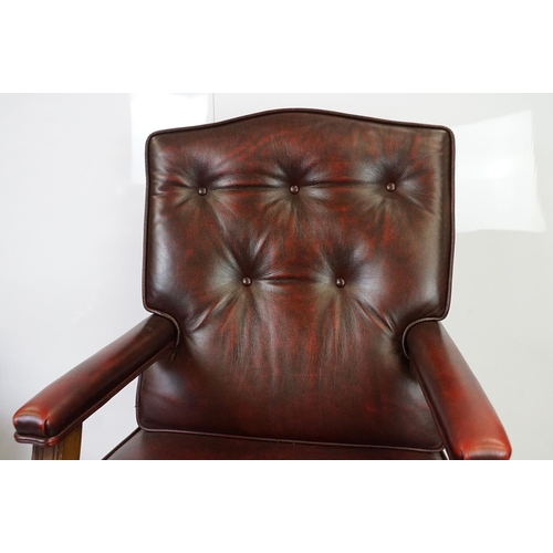 519 - Red leather adjustable height captain's chair, with button back, 107cm high x 60cm wide x 70cm deep ... 