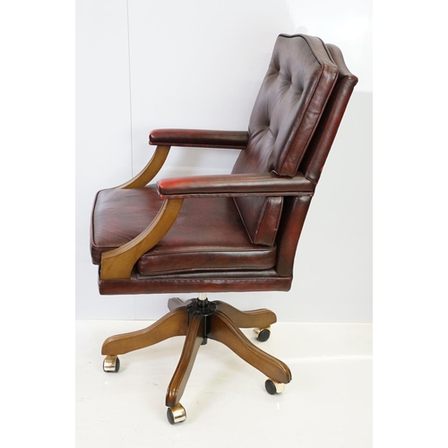 519 - Red leather adjustable height captain's chair, with button back, 107cm high x 60cm wide x 70cm deep ... 