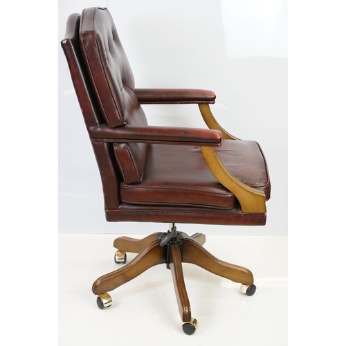 519 - Red leather adjustable height captain's chair, with button back, 107cm high x 60cm wide x 70cm deep ... 