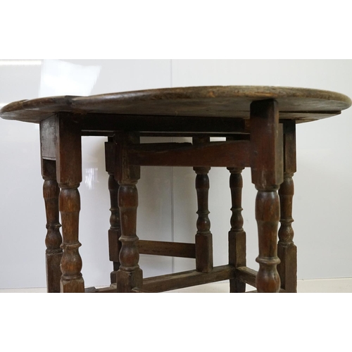 539 - 18th / 19th century oak drop leaf table of oval form on tuned legs, 6cm high x 97cm wide 89cm deep