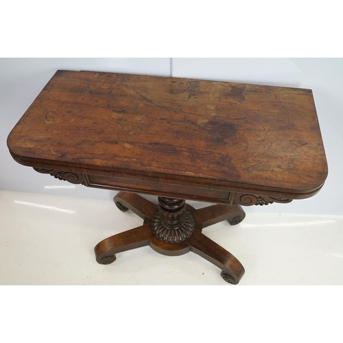 541 - William IV rosewood games table, top swivels to reveal enclosure,  on turned fluted support and four... 