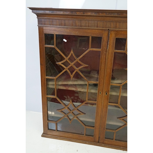 544 - 20th century mahogany astragal glazed two door display cabinet fitted with three shelves, 107cm high... 