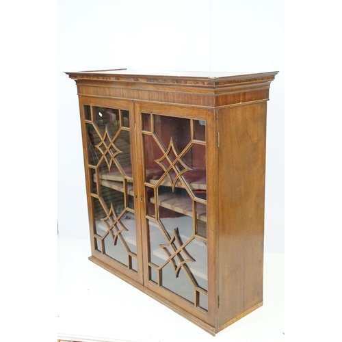 544 - 20th century mahogany astragal glazed two door display cabinet fitted with three shelves, 107cm high... 