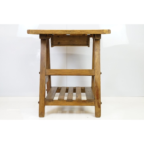 553A - Early vintage pine work table with underslung drawer and pot shelf below, 81.5cm high x 75cm wide x ... 