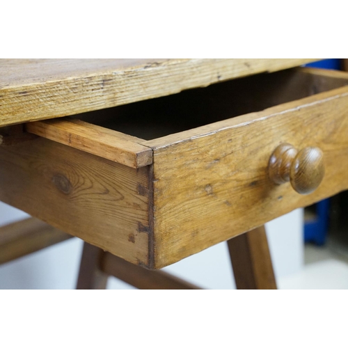 553A - Early vintage pine work table with underslung drawer and pot shelf below, 81.5cm high x 75cm wide x ... 