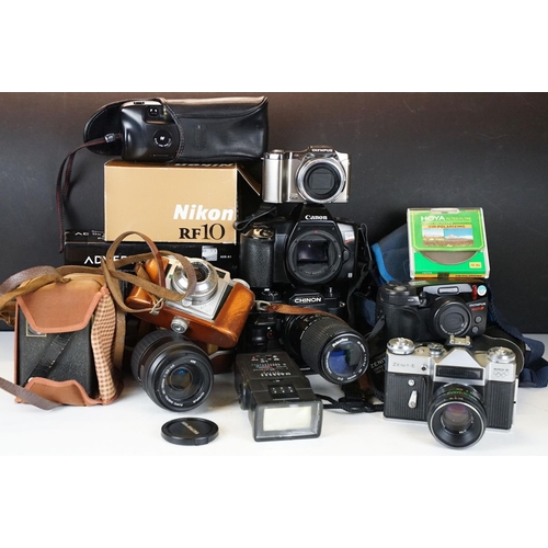 388A - A collection of mixed photographic equipment to include Zenit and Chinon 35mm SLR cameras together w... 