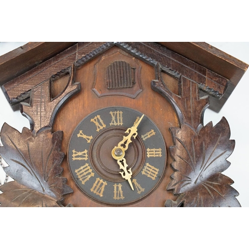 389A - A vintage German cuckoo clock complete with weights.