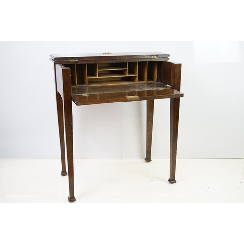 546 - 20th century oak fall front desk, with fitted stationery enclosure, on square tapering legs, with ke... 