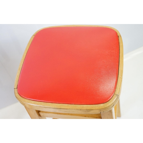 547 - Pair of vintage kitchen high stools, with red leatherette padded seats, each 72.5cm high x 33cm wide... 