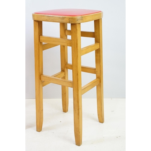 547 - Pair of vintage kitchen high stools, with red leatherette padded seats, each 72.5cm high x 33cm wide... 