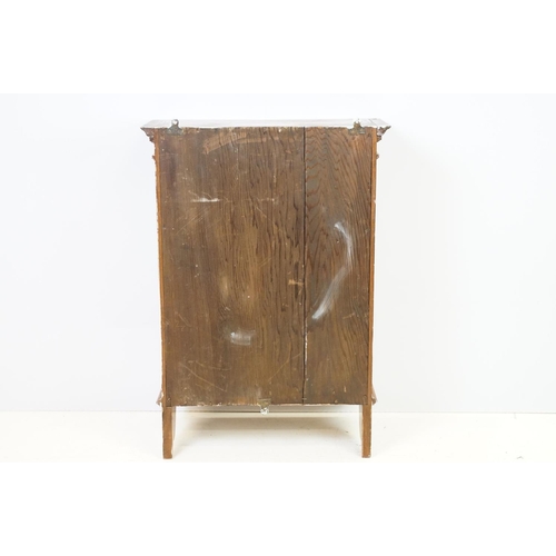 555 - 20th century mahogany hanging wall cabinet, with panelled door above carved bracket base, the interi... 