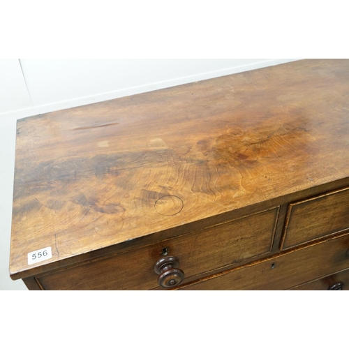 556 - Victorian mahogany chest of two short and three long drawers, with turned handles on turned bun feet... 