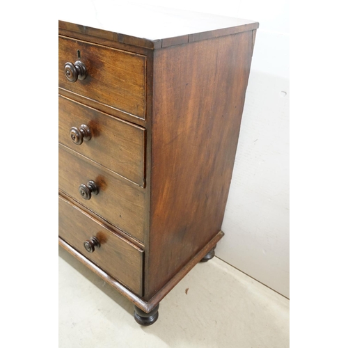 556 - Victorian mahogany chest of two short and three long drawers, with turned handles on turned bun feet... 