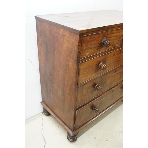 556 - Victorian mahogany chest of two short and three long drawers, with turned handles on turned bun feet... 