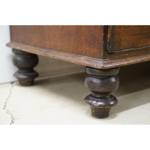 556 - Victorian mahogany chest of two short and three long drawers, with turned handles on turned bun feet... 