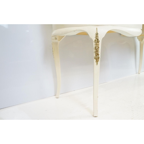 569A - French style white kidney shaped dressing table with gilt trim and an arrangement of five drawers, w... 