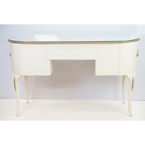 569A - French style white kidney shaped dressing table with gilt trim and an arrangement of five drawers, w... 