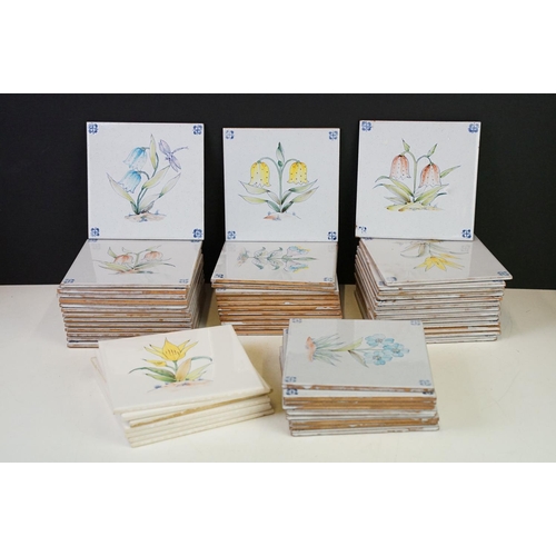 84 - Collection of tin glazed wall tiles each decorated with floral sprays. 4 small boxes.