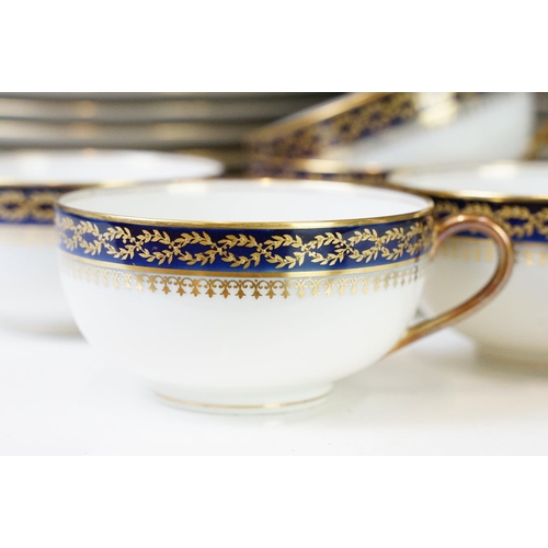 85 - 20th Century vintage Limoges tea service having a white ground with navy blue and gilt rims. Green R... 