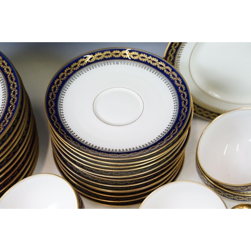 85 - 20th Century vintage Limoges tea service having a white ground with navy blue and gilt rims. Green R... 