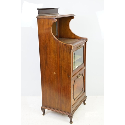 579 - 20th century mahogany music cabinet, with two cupboards below mirrored shelf area, 124cm high x 48cm... 