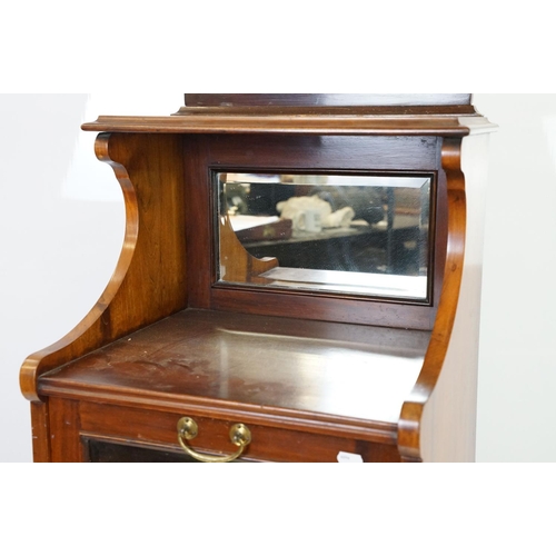 579 - 20th century mahogany music cabinet, with two cupboards below mirrored shelf area, 124cm high x 48cm... 