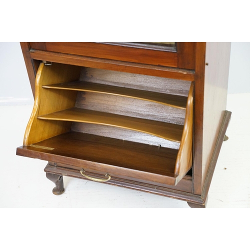 579 - 20th century mahogany music cabinet, with two cupboards below mirrored shelf area, 124cm high x 48cm... 